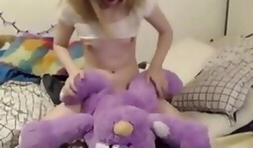 Sexy tranny in pigtails fucking her plushie