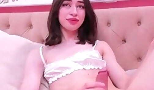 slim teen transgirl with long legs strokes her cock on webcam