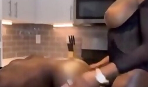 Busty ebony shemale humiliates a dude in the kitchen