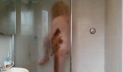 In the shower covered in chocolate
