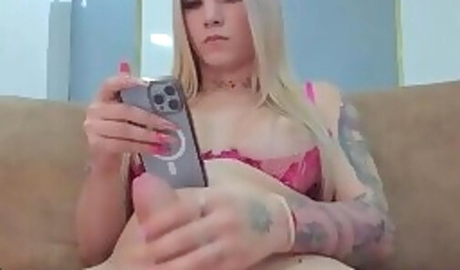 Tattooed blonde playing her cock