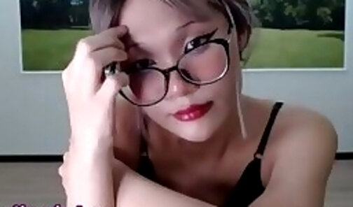 19 yo skinny japanese shemale in glasses strokes her big dick on webcam