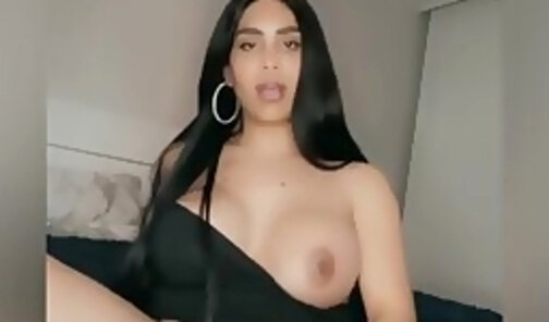 Nutting in a black dress with her tits out