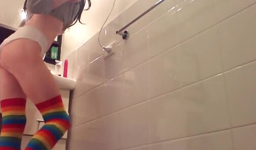 Kooky nerdy transgirl covering herself in lube
