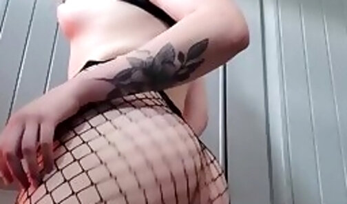 Her pp is sticking out of her fishnets