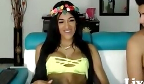 Beautiful Latin shemale jerking off next to her bf