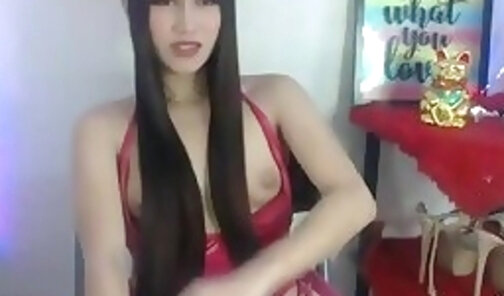 long haired tgirl strokes her cock on webcam