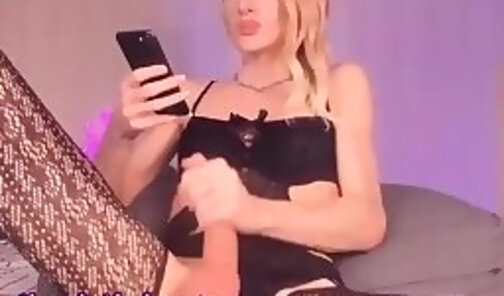 skinny Ukranian blonde translady in stockings tugs her big dick on cam