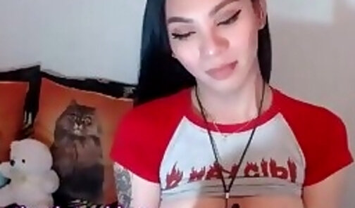 slim ladyboy with big boobs and tattoos wanks on webcam