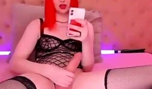 redhaired russian transgirl in stockings strokes her big heavy cock on webcam